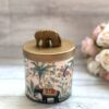 A handmade soy wax candle with natural fragrance oils, encapsulated in a reusable jar. The candle emits a warm, inviting glow as it burns, filling the room with a delightful scent.